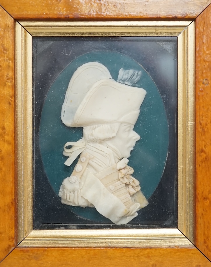 Attributed to Leslie Ray (20th century), a pair of maple framed wax reliefs, a lady and a gentleman in naval uniform, 21.5 x 19cm total. Condition - good